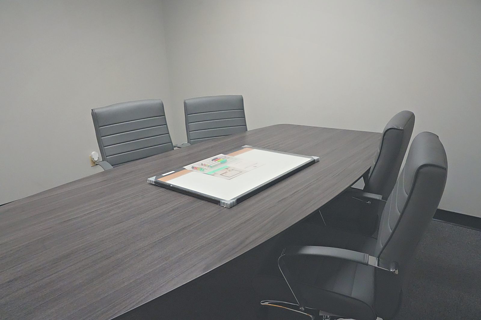 Conference room with modern table and leather chairs