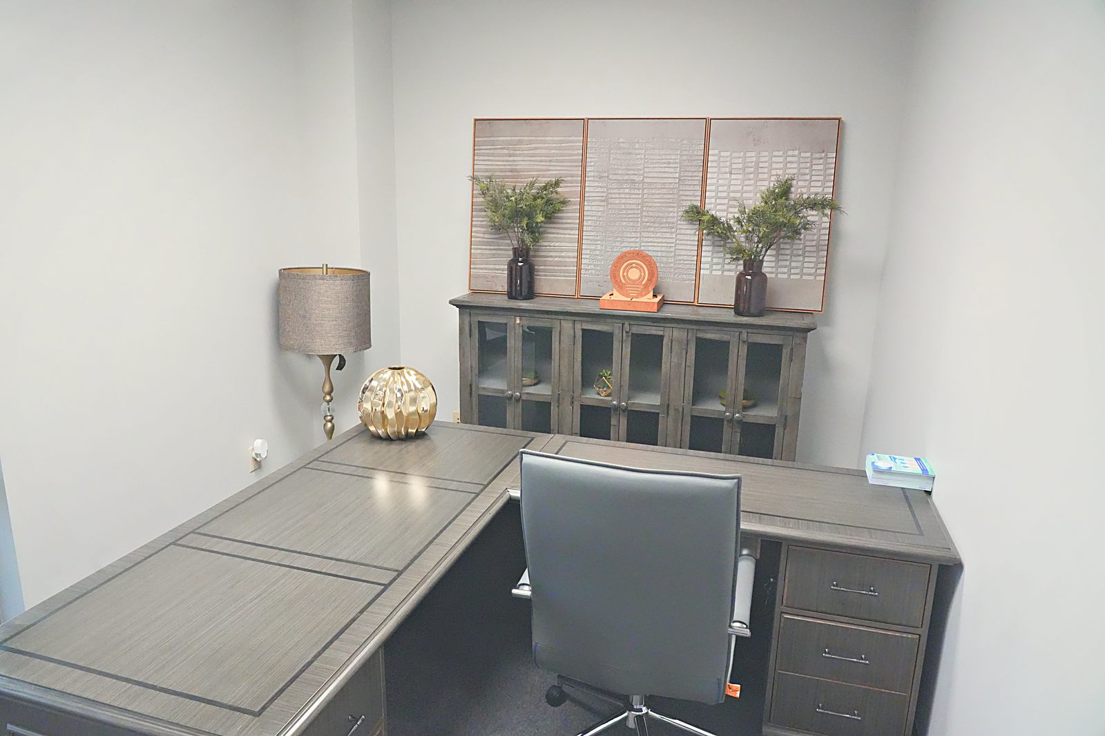 Executive office in grays and brass