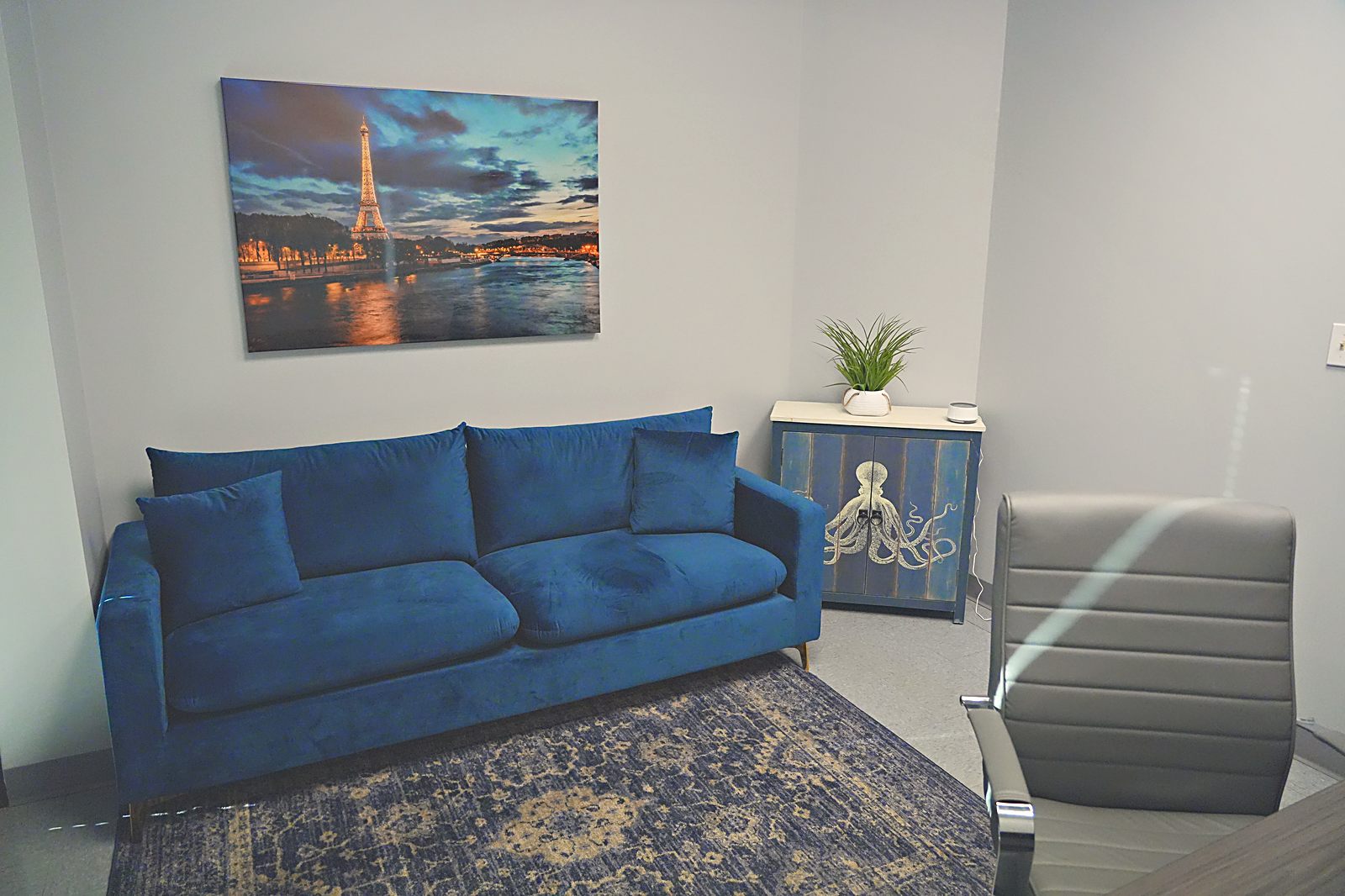 Navy sofa lounge with cityscape art